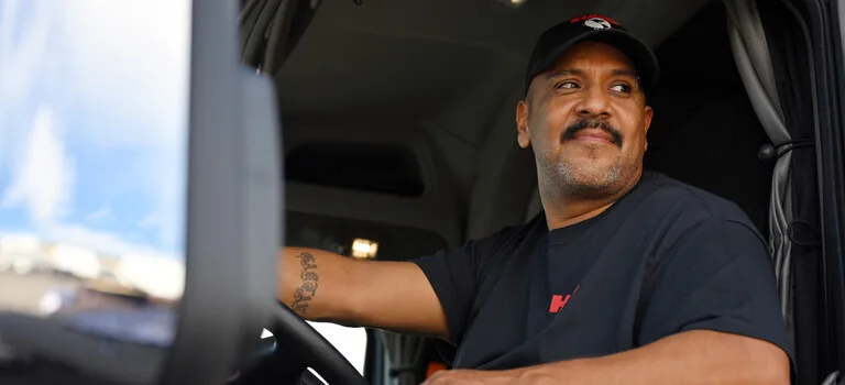 Truck driver inside a cab